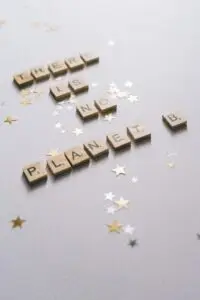 There is no planet B spelt out in scrabble letters with gold stars scattered on the table. Designed to show young voices.